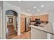Modern kitchen with stainless steel appliances, breakfast bar, and granite countertops at 4044 Villeroy Ave, Las Vegas, NV 89141