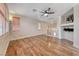 An open living area featuring beautiful hardwood floors and bright, neutral paint at 4044 Villeroy Ave, Las Vegas, NV 89141