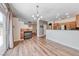 Open living space with modern light fixture, fireplace, and tile accents at 4044 Villeroy Ave, Las Vegas, NV 89141