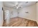 Large main bedroom with wooden floors, ceiling fan, and wall decor at 4044 Villeroy Ave, Las Vegas, NV 89141