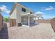 This spacious backyard features desert landscaping and a covered patio at 4132 Joyous St, North Las Vegas, NV 89032