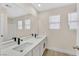 Modern bathroom features a double sink vanity, sleek fixtures, and ample natural light at 4132 Joyous St, North Las Vegas, NV 89032