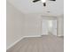 Bright bedroom with neutral walls and soft carpet, enhanced by a ceiling fan and natural light at 4132 Joyous St, North Las Vegas, NV 89032