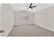 Bedroom with a ceiling fan, a window with blinds, and neutral walls with neutral carpet at 4132 Joyous St, North Las Vegas, NV 89032