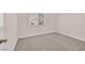 The room features neutral walls, carpet flooring and a window offering natural light at 4132 Joyous St, North Las Vegas, NV 89032