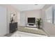 Well-furnished bedroom with stylish decor, comfortable bed, and a view of the staircase at 4132 Joyous St, North Las Vegas, NV 89032
