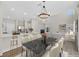 Open concept space features a modern dining area, a kitchen, and a living room, perfect for entertaining at 4132 Joyous St, North Las Vegas, NV 89032