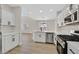Contemporary kitchen with stainless steel appliances, quartz countertops, and an open layout at 4132 Joyous St, North Las Vegas, NV 89032