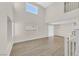 Bright, empty living room featuring hardwood floors and large windows at 4132 Joyous St, North Las Vegas, NV 89032
