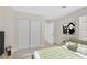 Bedroom with ceiling fan, bed with padded headboard, and closet access at 4132 Joyous St, North Las Vegas, NV 89032