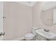 A charming powder room with a pedestal sink and stylish fixtures enhances the home's appeal at 4132 Joyous St, North Las Vegas, NV 89032
