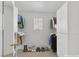 A closet with custom organizers including shelves, rods, drawers, and a small window at 4132 Joyous St, North Las Vegas, NV 89032