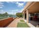 Outdoor patio space with rock landscaping, plants, and a peek at the beautiful desert views at 414 Crystal Canyon Dr, Mesquite, NV 89027