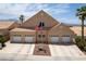 Inviting home featuring a three-car garage, manicured yard, desert landscaping, and a traditional design at 414 Crystal Canyon Dr, Mesquite, NV 89027