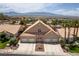 Expansive three-car garage home with desert landscaping offers curb appeal and ample parking against mountain views at 414 Crystal Canyon Dr, Mesquite, NV 89027
