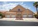 Attractive single-story home with a three-car garage and well-maintained landscaping at 414 Crystal Canyon Dr, Mesquite, NV 89027