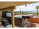 Backyard hot tub with easy-access steps and privacy covers offering a relaxing outdoor experience at 414 Crystal Canyon Dr, Mesquite, NV 89027