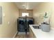 Bright laundry room featuring a washer, dryer and sink at 414 Crystal Canyon Dr, Mesquite, NV 89027
