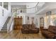 Bright living room featuring high ceilings, staircase, and wood floors at 414 Crystal Canyon Dr, Mesquite, NV 89027