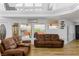 Spacious living room featuring mountain views, lots of natural light, and wood floors at 414 Crystal Canyon Dr, Mesquite, NV 89027