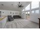 Open-concept living room with large windows and a ceiling fan at 414 Crystal Canyon Dr, Mesquite, NV 89027