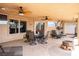 Covered patio featuring tile flooring, ceiling fans, outdoor furniture, and a beautiful backyard at 414 Crystal Canyon Dr, Mesquite, NV 89027