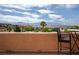 Inviting patio seating area with panoramic views of lush landscape and distant mountains, perfect for relaxation and entertaining at 414 Crystal Canyon Dr, Mesquite, NV 89027