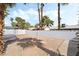 Spacious backyard surrounded by a block wall for privacy with mature palms at 4312 Chrysalis Dr, Las Vegas, NV 89121