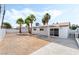 Wide shot of backyard with mature landscaping and covered patio area at 4312 Chrysalis Dr, Las Vegas, NV 89121