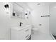 Stylish bathroom with modern vanity, black fixtures, and tile flooring at 4312 Chrysalis Dr, Las Vegas, NV 89121