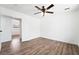 Spacious bedroom with hardwood flooring, a ceiling fan, and ample natural light at 4312 Chrysalis Dr, Las Vegas, NV 89121