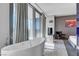 Bright bathroom with a freestanding tub, large windows, and city views at 4381 W Flamingo Rd # 1121, Las Vegas, NV 89103