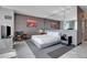 Contemporary bedroom design with mirrored wall, city art, and comfortable furnishings at 4381 W Flamingo Rd # 1121, Las Vegas, NV 89103