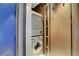 A stackable washer and dryer maximizing space efficiency inside a laundry closet at 4381 W Flamingo Rd # 1121, Las Vegas, NV 89103