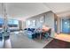 Open-concept living area with sleek furnishings, a desk area, and a comfortable bed, all with cityscape views at 4381 W Flamingo Rd # 1121, Las Vegas, NV 89103