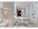 A luxurious bathroom featuring marble countertops, glass shower enclosure, and modern fixtures at 4381 W Flamingo Rd # 1206, Las Vegas, NV 89103