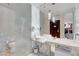 A modern bathroom with double sinks, sleek fixtures, and elegant lighting at 4381 W Flamingo Rd # 1206, Las Vegas, NV 89103