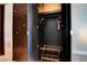 A well-organized closet space featuring dark wood panels and ample storage solutions at 4381 W Flamingo Rd # 1206, Las Vegas, NV 89103