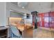 Modern kitchenette featuring stainless steel appliances and a wood breakfast bar at 4381 W Flamingo Rd # 1206, Las Vegas, NV 89103