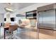 A modern stainless steel kitchenette featuring a sink, microwave, and mini refrigerator at 4381 W Flamingo Rd # 1206, Las Vegas, NV 89103
