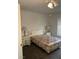 Bedroom features a bed with floral bedding, side tables with lamps, and window at 4555 E Sahara Ave # 122, Las Vegas, NV 89104