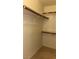 Walk-in closet features shelving, hanging rods, and carpeted floors at 4555 E Sahara Ave # 122, Las Vegas, NV 89104