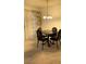 Dining area with modern chandelier and a dining table with seating for four people at 4555 E Sahara Ave # 122, Las Vegas, NV 89104
