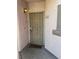 Unit 122 front door with security screen, welcome mat, and ambient lighting for added safety and comfort at 4555 E Sahara Ave # 122, Las Vegas, NV 89104