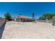 Enjoy a spacious backyard with desert landscaping, offering ample potential for customization and outdoor activities at 475 E Robindale Rd, Las Vegas, NV 89123