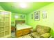 Bedroom featuring a door to outside, bed and a chair at 475 E Robindale Rd, Las Vegas, NV 89123