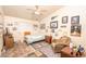 Bedroom showcasing a ceiling fan, chair and a collection of decor at 475 E Robindale Rd, Las Vegas, NV 89123