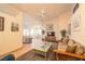 Comfortable living room area with tile flooring seamlessly connecting to dining space at 475 E Robindale Rd, Las Vegas, NV 89123