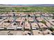 An aerial view of a well maintained community with a desert landscape backdrop at 5043 Mascaro Dr, Las Vegas, NV 89122