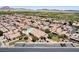 An aerial view of a well maintained community featuring a pool and mini golf course at 5043 Mascaro Dr, Las Vegas, NV 89122